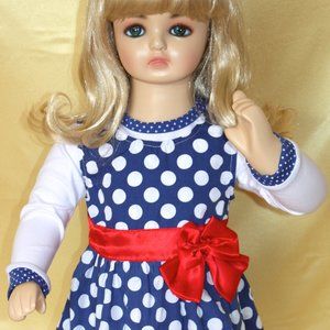 Girls dress blue and white with red bow